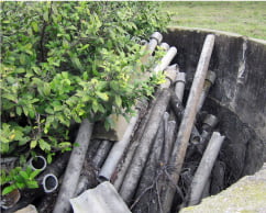 Asbestos cement pipes dumped in a water tank