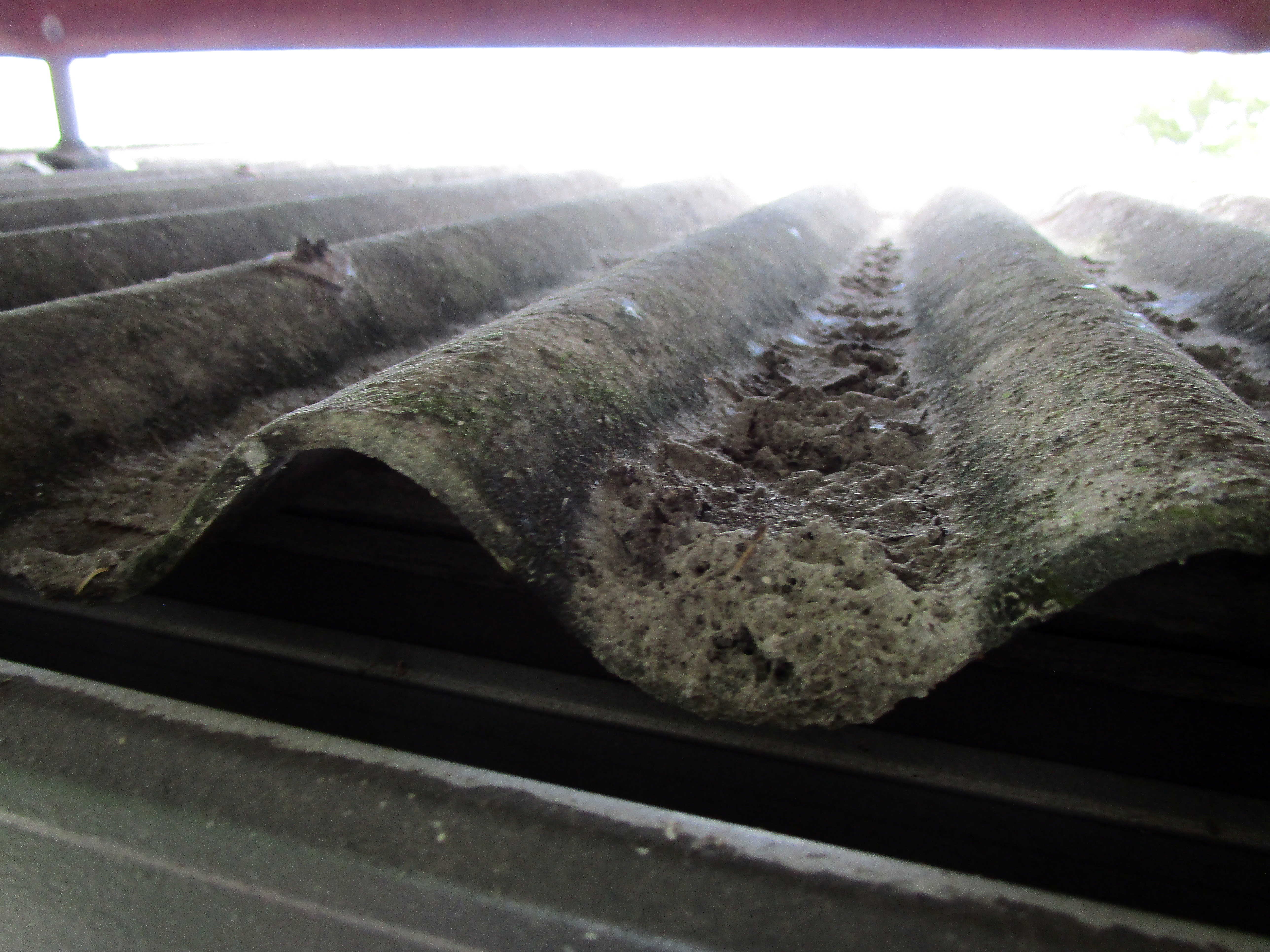 Asbestos storm damaged corrugated roof cladding Asbestos Audits