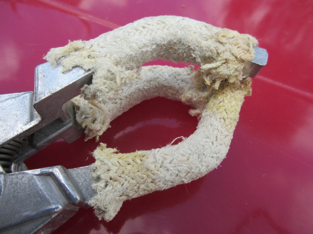 Woven asbestos on retort clamp