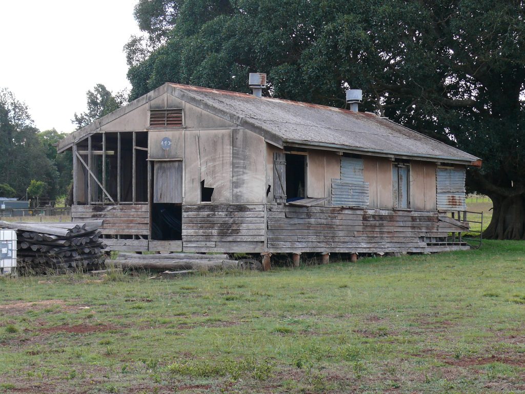 An Asbestos Survey of a Farm found this old asbestos wartime shed being used for storage